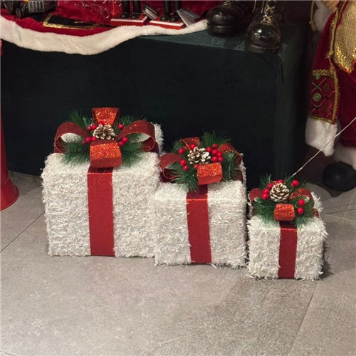 White boxes under tree (lights up)